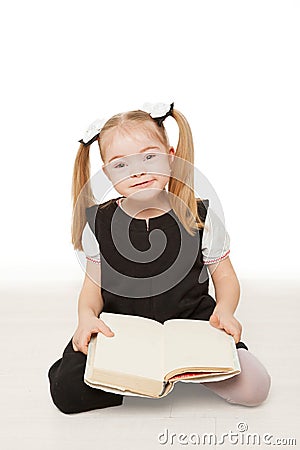 Preschooler girl reading a book. Stock Photo