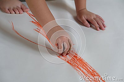 Preschoolers are practicing coloring on white paper Stock Photo