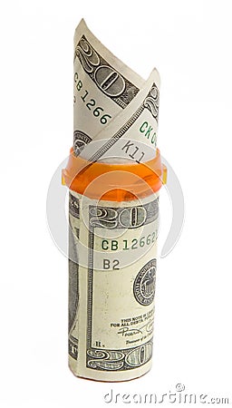 Prescription bottle with $20 bills isolated. Stock Photo