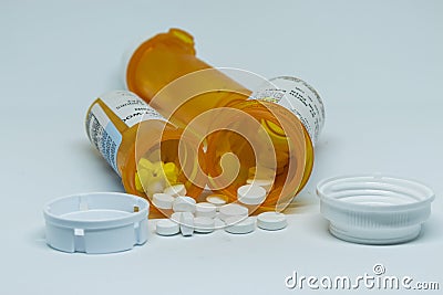 Oxycodone pills spilled out of perscription containers Editorial Stock Photo