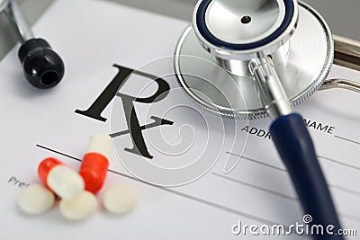 Prescription lying on clipboard pad with stethoscope Stock Photo