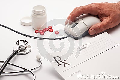 Prescription medicine and computer mouse Stock Photo