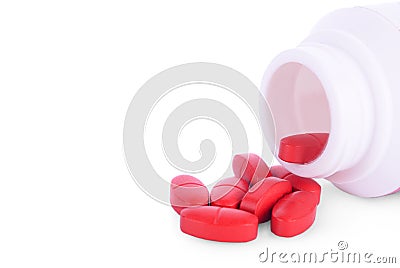 Prescription medication cascading out of orange pharmacy vials isolated on white Stock Photo