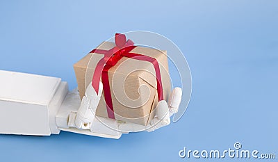 Present box in robotics hand, blue background Stock Photo