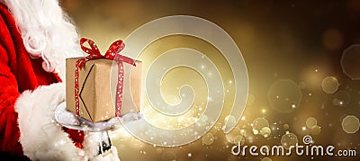 A Present For Christmas - Vintage Golden Background With Santa Claus Stock Photo