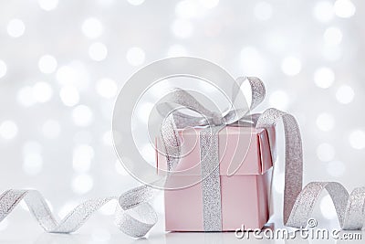 Present or gift box against bokeh background. Holiday greeting card on Birthday or Christmas. Stock Photo