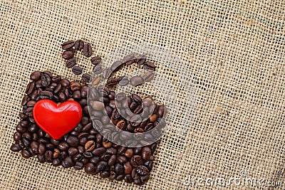 Present made of coffee beans with red heart Stock Photo