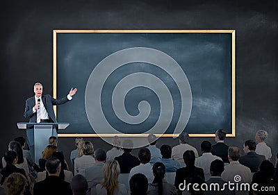 Presentation of a Speaker to a Large Group of Business People Stock Photo