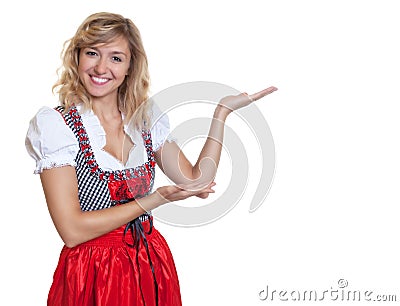 Presenting german woman in a traditional bavarian dirndl Stock Photo