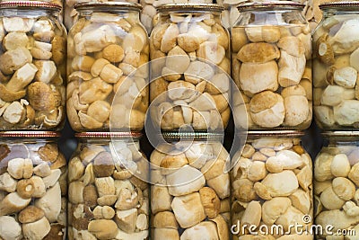 The preserve mushrooms. Glass jars of delicious marinated Boletus edulis. Homemade preservation in autumn Stock Photo