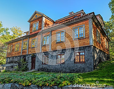 Preserved summer residence Jacobsberg from Hornstull in Skansen the Sconce open-air Museum of Architecture and Life at sunny Editorial Stock Photo