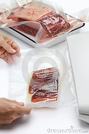 Preserving food in a vacuum sealer Stock Photo