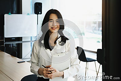 The president of the company smiles with joy that the company's profits have exceeded certain thresholds during the Stock Photo