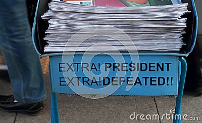 President Defeated, headlines on a Newspaper stack Stock Photo