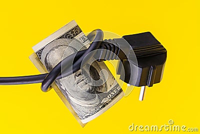 The president on a dollar bill with his eyes blindfolded with an electric cord. The concept of the energy crisis Stock Photo