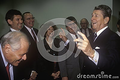 President Ronald Reagan jokes with politicians and reporters Editorial Stock Photo