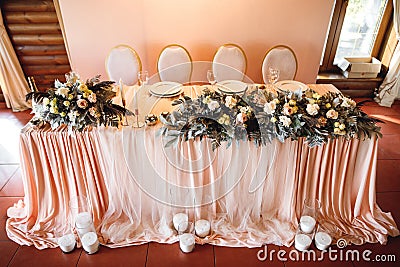 The presidium with flowers and candle of the newlyweds at the wedding Stock Photo