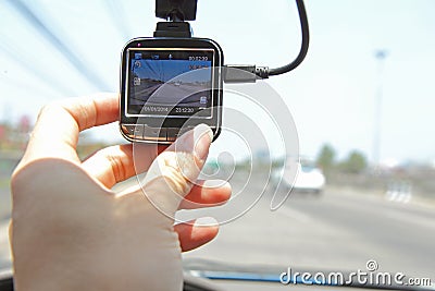 Press the button of front camera car recorder Stock Photo