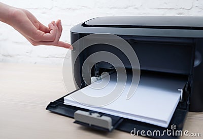Press the button to enable or disable printer Stock Photo