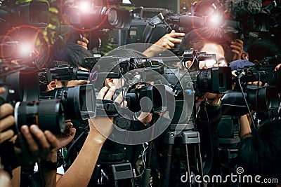 Press and media camera ,video photographer on duty in public new Stock Photo