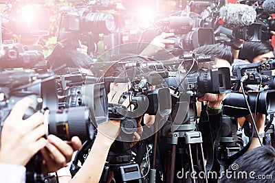 Press and media camera ,video photographer on duty in public new Editorial Stock Photo