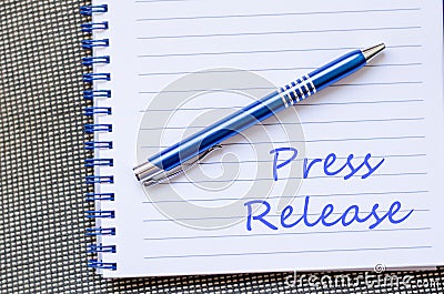 Press release write on notebook Stock Photo