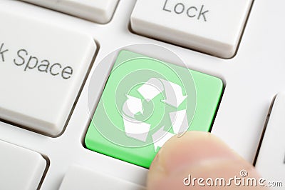 Pressing recycle symbol key Stock Photo