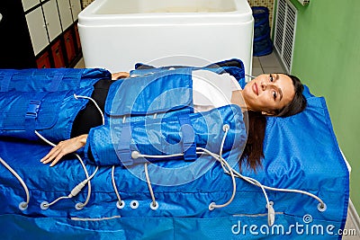 Pressotherapy treatment - lymphatic drainage massage. Non-surgical hardware cosmetology Stock Photo