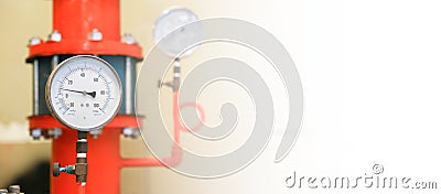 Pressure gauge psi meter in pipe and valves of fire emergency system industry Stock Photo