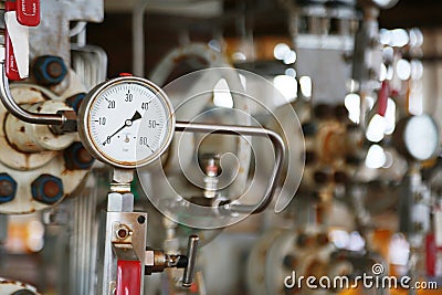 Pressure gauge using measure the pressure in production process. Worker or Operator monitoring oil and gas process Stock Photo