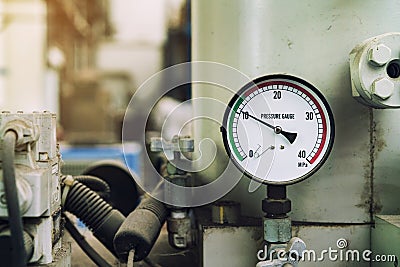 Pressure gauge was mounted on the old machine Stock Photo