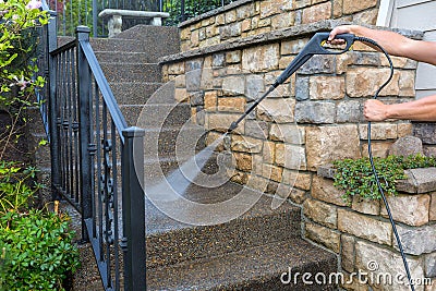 Pressure Power Washing the Front Entrance Stair Steps Stock Photo