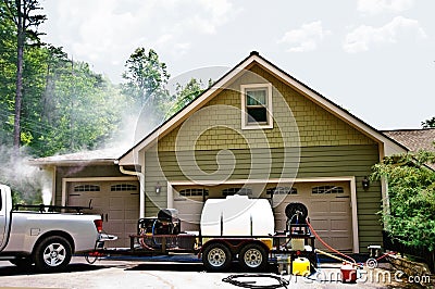 Pressure Washing a House Stock Photo