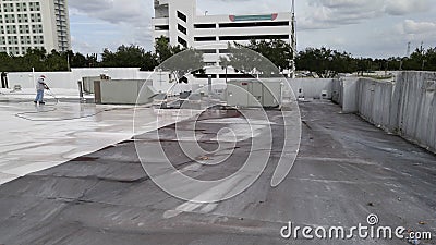 Pressure Washing TPO roof, roof maintenance Stock Photo