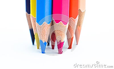 Pressuring bunch of different colored wood pencil on a white paper background Stock Photo