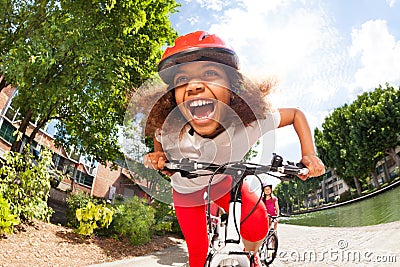 Preteen African girl racing in full speed Stock Photo