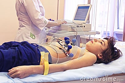 Preteen boy under ecg test Stock Photo