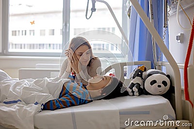 Preteen child, boy, lying in hospital with fractured thoracic spine, vertebralis Stock Photo