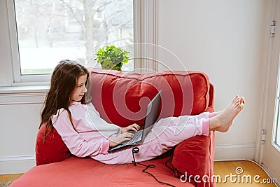 Preteen girl enjoyes homeschooling. Remote education and lockdown concept Stock Photo