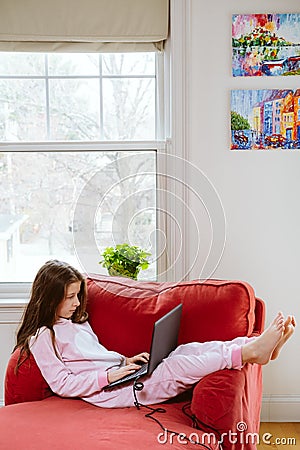 Preteen girl enjoyes homeschooling. Remote education and lockdown concept Stock Photo