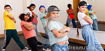 Preteen girls and boys hip hop dancers doing dance workout Stock Photo