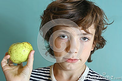 Preteen handsome boy hold green apple Stock Photo