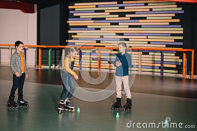 Preteen roller skaters practicing skating Stock Photo