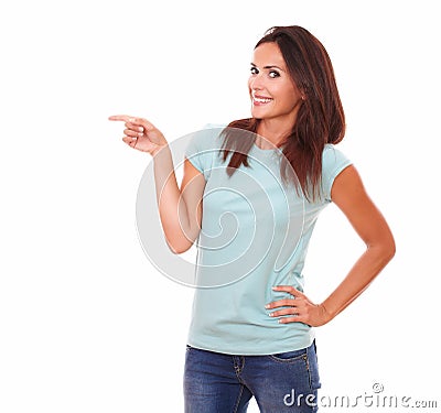 Pretty adult woman pointing to her right Stock Photo