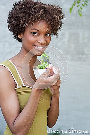 Pretty African American woman with salad Stock Photo