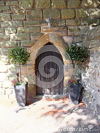 Pretty arched door at the pele tower, Corbridge, Northumberland, UK Editorial Stock Photo