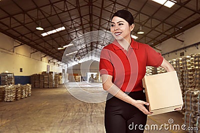 Pretty asian courier woman bring the package Stock Photo