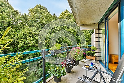 Pretty balcony with lots of greenery Stock Photo