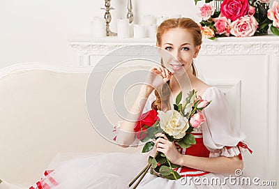 Pretty ballerina holding flowers Stock Photo