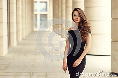 Pretty beautiful business woman in elegant black dress Stock Photo